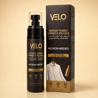 VELO Live Ease Instant Fabric Wrinkle Release spray bottle and its retail box, both in black with gold lettering, set against a warm beige background.